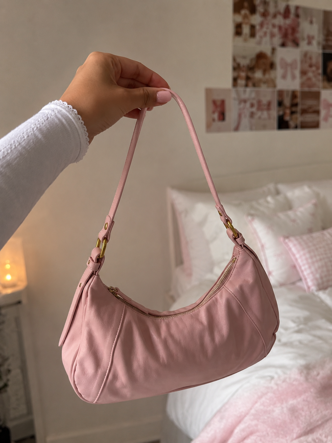 a Bu. member holding up a new pink bag